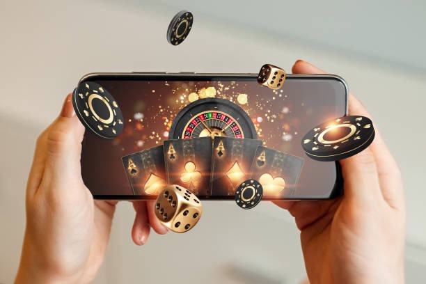 Microgaming slot games displayed on a mobile phone screen within login rakatoto